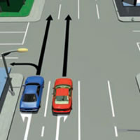 Picture of a car passing on the left at a laned intersection