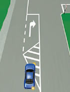 Picture of a car in a right-turn bay, indicating to turn right