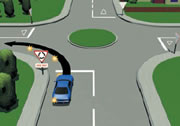 Picture of a car signalling left at a single-laned roundabout