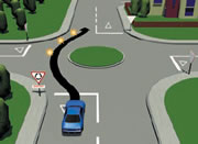 Picture of a car driving straight through a single-laned roundabout